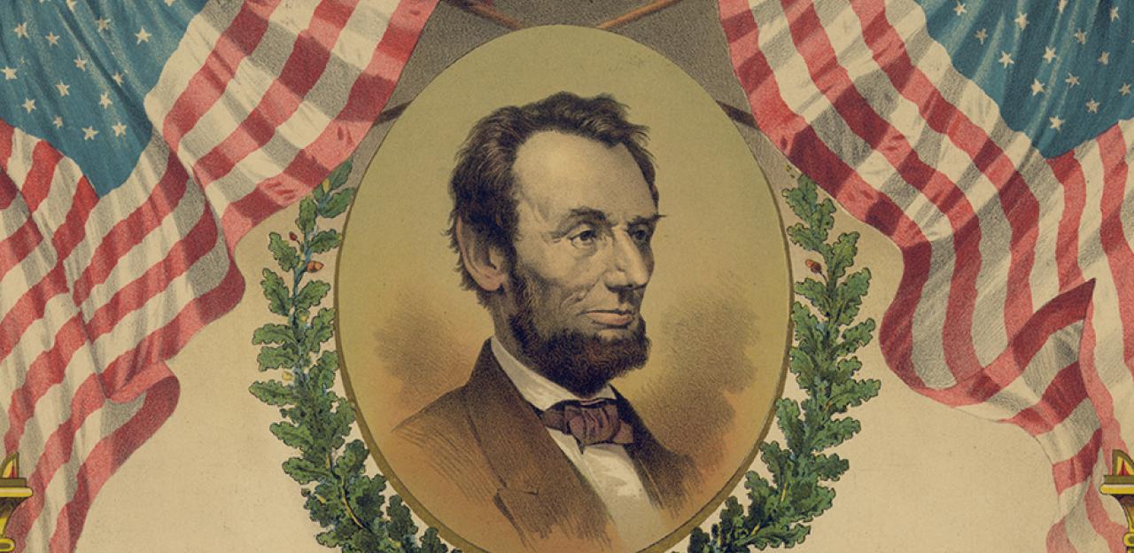 A portrait of Abraham Lincoln bordered by two American flags