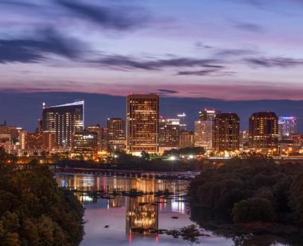 City skyline at night with river at the bottom