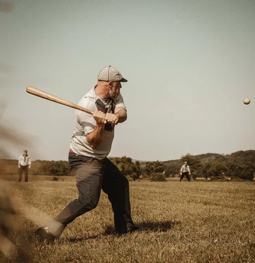 A striker from Eclipse BBC of Elkton facing a pitch from the Lisbon Tunnelmen.