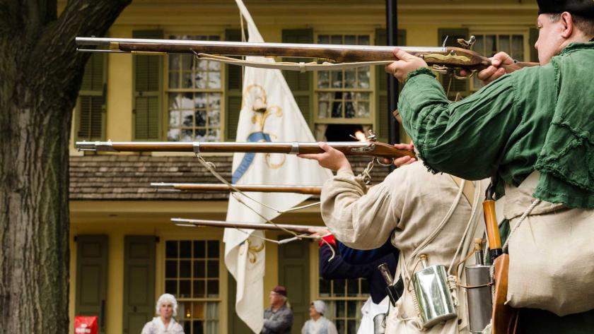 Re-enactors firing in front of Indian King Tavern