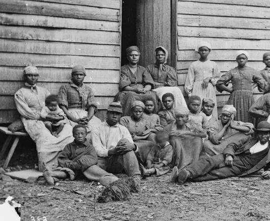 This is a photograph of contrabands in Cumberland Landing, Virginia during the Peninsula Campaign.