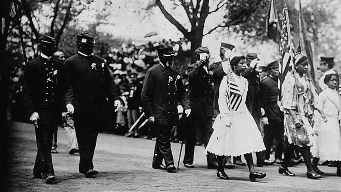 African American GAR veterans and family marching in New York City, 1912